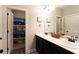 Bathroom with double sink vanity, dark cabinets, and bath/shower combo at 35 Rock Rose Dr, Covington, GA 30014