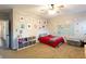 Bedroom with red accents, a map wall decal, and neutral carpet at 35 Rock Rose Dr, Covington, GA 30014