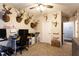 Inviting bedroom featuring a desk, mounted deer heads, and neutral carpet at 35 Rock Rose Dr, Covington, GA 30014