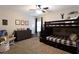 Cozy bedroom featuring a bunk bed with stairs, dresser, neutral walls, and a ceiling fan at 35 Rock Rose Dr, Covington, GA 30014