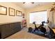 Bedroom with a stationary bike, dresser, natural light, and neutral carpet at 35 Rock Rose Dr, Covington, GA 30014