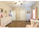 Bedroom featuring a six drawer dresser and two white paneled doors at 35 Rock Rose Dr, Covington, GA 30014