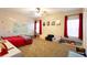 Bedroom with red accents, large windows, and built-in storage shelves at 35 Rock Rose Dr, Covington, GA 30014