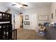 Neutral bedroom showcasing a bunk bed, dresser, and decor with white paneled doors at 35 Rock Rose Dr, Covington, GA 30014