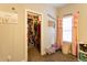 Walk-in closet adjacent to bedroom with natural lighting and pink curtains at 35 Rock Rose Dr, Covington, GA 30014