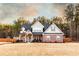 Charming two-story home with a brick facade, covered porch, and professionally landscaped yard at 35 Rock Rose Dr, Covington, GA 30014
