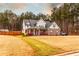 Beautiful two-story home with a well-maintained lawn and mature trees offering privacy at 35 Rock Rose Dr, Covington, GA 30014