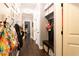Hallway with hardwood floors, grey walls and plenty of storage at 35 Rock Rose Dr, Covington, GA 30014