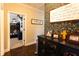 Hallway with an accent wall leading to bedroom with bunkbed and floral wallpaper at 35 Rock Rose Dr, Covington, GA 30014