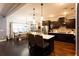 Modern kitchen with dark cabinetry, an island with seating, and stainless steel appliances at 35 Rock Rose Dr, Covington, GA 30014