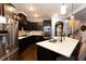 Stylish kitchen featuring dark cabinets, stainless steel appliances, and a spacious island at 35 Rock Rose Dr, Covington, GA 30014