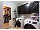 Laundry room including a closet and black cabinets at 35 Rock Rose Dr, Covington, GA 30014
