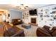 Comfortable living room with a fireplace, built-in shelving, and ample seating for Gathering and guests at 35 Rock Rose Dr, Covington, GA 30014