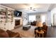 Spacious living room with a brick fireplace, built-in bookshelves, and large windows for natural light at 35 Rock Rose Dr, Covington, GA 30014