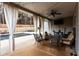 Back patio with curtains, ceiling fan, furniture, and a view of the pool at 35 Rock Rose Dr, Covington, GA 30014