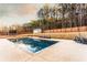 Backyard featuring a large pool, shed, playground, and fenced yard at 35 Rock Rose Dr, Covington, GA 30014