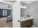 The spacious bathroom leads to a bedroom featuring natural light and tray ceilings at 526 Lakeside Dr, Hiram, GA 30141