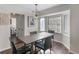 Dining room with natural light, modern lighting fixture, and seating for four at 526 Lakeside Dr, Hiram, GA 30141