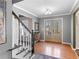 Inviting foyer with hardwood floors, staircase, and double doors leading to the outside at 526 Lakeside Dr, Hiram, GA 30141