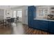 Bright kitchen with blue cabinets, white countertops, and hardwood floors adjacent to the dining room at 526 Lakeside Dr, Hiram, GA 30141