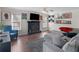 Cozy living room featuring a fireplace, ceiling fan, and ample natural light at 526 Lakeside Dr, Hiram, GA 30141