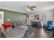 Cozy living room featuring hardwood floors, green accent wall, and lots of natural light at 526 Lakeside Dr, Hiram, GA 30141