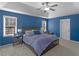 Comfortable main bedroom boasts a tray ceiling, carpet floors, and lots of natural light at 526 Lakeside Dr, Hiram, GA 30141