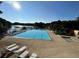 Enjoy the community pool with lake views, perfect for relaxation and recreation at 526 Lakeside Dr, Hiram, GA 30141