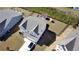 Aerial view showcases the property's fenced backyard, and proximity to neighboring homes, in a planned community at 60 Cottontail Lane, Villa Rica, GA 30180