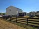 A backyard featuring a black fence, a shed, and an outdoor seating area at 60 Cottontail Lane, Villa Rica, GA 30180