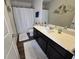 Bright bathroom with white countertop, dark cabinets, and modern fixtures at 60 Cottontail Lane, Villa Rica, GA 30180