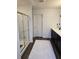 Spacious bathroom with a glass-enclosed shower, dark cabinets, and a bright vanity at 60 Cottontail Lane, Villa Rica, GA 30180