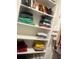 Closet features stacked shirts on shelves and purse storage at 60 Cottontail Lane, Villa Rica, GA 30180