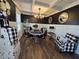 Stylish dining room featuring modern decor, elegant chandelier, and contrasting dark walls with white trim at 60 Cottontail Lane, Villa Rica, GA 30180