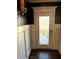 Elegant entryway features a decorative front door with glass detail, wainscoting, and modern fixtures at 60 Cottontail Lane, Villa Rica, GA 30180