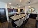 Modern kitchen featuring a granite island, dark cabinets, and stainless steel appliances at 60 Cottontail Lane, Villa Rica, GA 30180