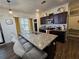 Modern kitchen featuring a granite island, dark cabinets, and stainless steel appliances at 60 Cottontail Lane, Villa Rica, GA 30180