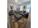 Cozy living room with modern sofas, a stone-patterned rug, and natural light at 60 Cottontail Lane, Villa Rica, GA 30180