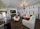 Inviting living room featuring modern decor, fireplace, coffered ceiling, and stylish furnishings at 60 Cottontail Lane, Villa Rica, GA 30180