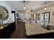 Open-concept living space showcases the kitchen with granite countertops and a connected seating area with natural light at 60 Cottontail Lane, Villa Rica, GA 30180