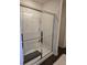 Modern shower with glass enclosure, bright lighting, and tiled walls at 60 Cottontail Lane, Villa Rica, GA 30180