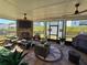 Inviting sunroom with comfortable seating, a brick fireplace, and views of the backyard at 60 Cottontail Lane, Villa Rica, GA 30180
