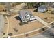 The property's expansive lot is highlighted in this aerial view, showcasing mature trees and landscaping at 6801 Louis Dr, Locust Grove, GA 30248