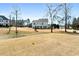 Lawn view of home with covered patio and large yard at 6801 Louis Dr, Locust Grove, GA 30248
