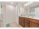 Bathroom featuring double sinks, ample cabinetry, and modern fixtures at 6801 Louis Dr, Locust Grove, GA 30248