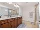 Bathroom featuring a double vanity, shower, and ample counter space at 6801 Louis Dr, Locust Grove, GA 30248
