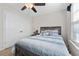 Comfortable bedroom features a bed, nightstand, and closet with paneled doors at 6801 Louis Dr, Locust Grove, GA 30248