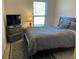 Comfortable bedroom with neutral colors and ample natural light at 6801 Louis Dr, Locust Grove, GA 30248