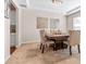Dining room with tray ceiling and modern chandelier at 6801 Louis Dr, Locust Grove, GA 30248