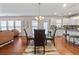 Dining area features modern chandelier and hardwood flooring at 6801 Louis Dr, Locust Grove, GA 30248